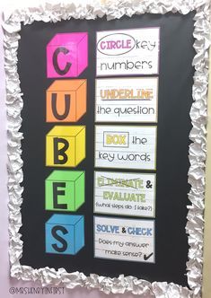 a bulletin board with cubes on it and the words cubes written in different colors