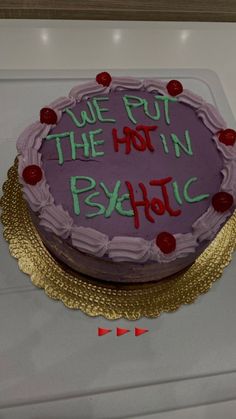 a cake with writing on it that says we put the hot in psychic