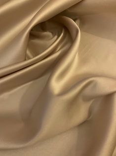 a close up view of a beige fabric