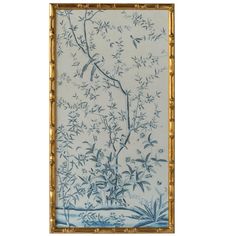 a blue and white painting with bamboo frame