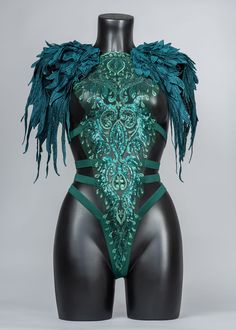 a mannequin with green feathers on it