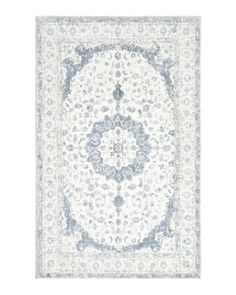 a white and blue rug with red border