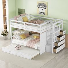 a white bunk bed sitting next to a dresser