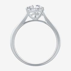 a diamond engagement ring on a white background