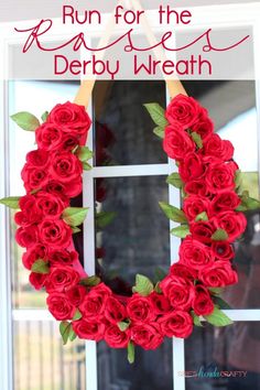 a wreath made out of red roses sitting in front of a window with the words, run for the rose derby wreath