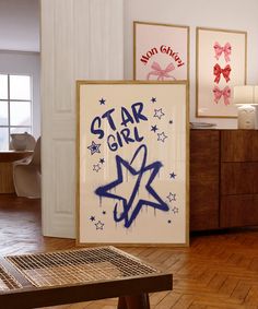 there is a star girl sign on the wall next to a wooden table in this room