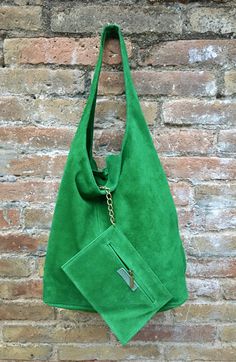 LARGE slouch leather bag in GREEN . Leather tote bag. Closed with a zipper at the top. Natural genuine SUEDE leather. NOT LINED. We added a small leather zipper pouch for your mobile phone and/or cards or money. It ist attached to the inside of the bag by a metal chain. This listing is for the bag in bright GREEN , there is a separate listing in our shop for moss green and also for the dark green bag on the last picture with the model. THIS STYLE IN BRIGHT GREEN comes with the zipper at the top Green Soft Leather Rectangular Bucket Bag, Green Soft Leather Bucket Bag With Double Handle, Green Soft Leather Double Handle Bucket Bag, Green Pouch Hobo Bag For Shopping, Green Leather Tote Hobo Bag, Green Leather Hobo Bag With Large Capacity, Green Leather Hobo Tote Bag, Green Leather Hobo Shoulder Bag, Green Large Capacity Hobo Bag