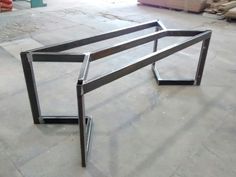 a metal frame sitting on top of a cement floor