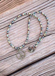 Minimalist Style Hippie Peace Sign Pendant Seed Bead Layering Necklace Boho Multicolor Picasso Red Blue Chartreuse Turquoise Brown Yellow DP Minimalist Festival Beaded Necklace With Round Beads, Minimalist Round Beaded Necklace For Festivals, Casual Turquoise Jewelry With Tiny Beads, Minimalist Adjustable Beaded Necklaces For Festivals, Hippie Style Nickel-free Necklaces For Festivals, Hippie Nickel-free Necklaces For Festivals, Nickel Free Hippie Necklaces For Festivals, Bohemian Peace Sign Necklace For Gift, Bohemian Adjustable Beaded Necklaces For Everyday