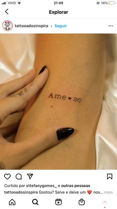 a woman's stomach with the word tattoo on her left side ribcage