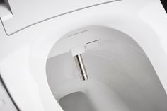 a close up of a toilet with the lid open