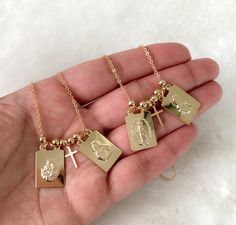 "Gold filled scapular necklace If you're a catholic person, I'm sure you will like this dainty scapular with 18k gold filled chain. It's a necklace you can wear everyday. Simple, classic and elegant. MATERIAL AND SIZE 18k GoldFilled scapular Scapular size: 2.1cmx1.3cm 18k Gold filled chain Length: 40cm or 16\", 45 cm or 18 inches #1: Our Lady of Mount Carmel and Sacred Heart #2: Miraculous Virgin Mary and Sacred Heart If you have questions about the product, feel free to reach me out. Don't forg Virgin Mary Sacred Heart, Scapular Necklace, Our Lady Of Mount Carmel, Virgin Mary Necklace, Silver Locket Necklace, Mount Carmel, Catholic Jewelry, Miraculous Medal, Silver Lockets