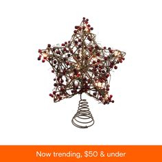 a christmas star decoration with red berries on it and the words now trending $ 50 & under