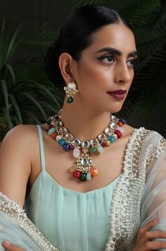 This navrattan necklace set with its pop of colors and quirky shapes is a sublime piece. The subtelty of the polki with hints of muted golden tones creates the perfect balance to create a winning look. Necklace Closure - Adjustable Dori Earrings Closure - Push Back Style Tip - This multicolored piece of art is perfect for gracing traditional funtions in full pomp and show. Navrattan itself being the traditional epitome of prosperity, wealth and status. What could be better than Handcrafted in Ja Fusion Style Multicolor Kundan Necklace For Party, Party Multicolor Fusion Kundan Necklace, Party Style Fusion Multicolor Kundan Necklace, Party Fusion Style Multicolor Kundan Necklace, Multicolor Kundan Fusion Necklace, Unique Multicolor Festive Jewelry, Multicolor Handmade Kundan Necklace For Party, Handmade Multicolor Kundan Necklace For Party, Multicolor Necklaces For Festive Gifts