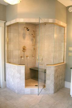 a walk in shower sitting inside of a bathroom