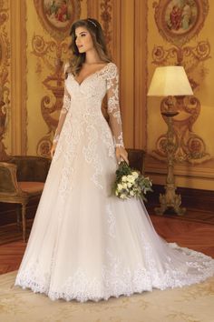 a woman in a white wedding dress holding a bouquet