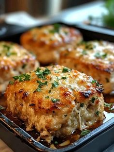 some meat patties are in a pan on the table and ready to be eaten