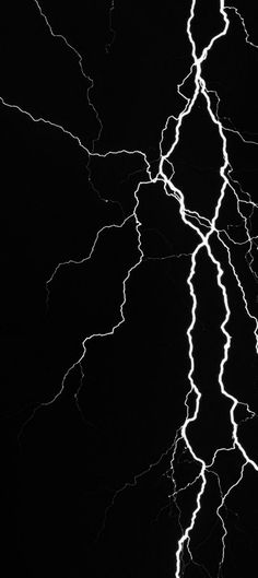 a black and white photo of lightning in the sky