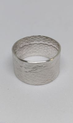 Hand-crafted texture Sterling silver band. Approximately 1/2" inches, Size 7 1/2 Elegant Thick Silver Band, Elegant Silver Thick Band, Classic Silver Wide Band, Classic Wide Band Silver Bands, Wide Band Silver Hammered Jewelry, Modern Adjustable Silver Band, Elegant Etched Silver Band, Elegant Handmade Wide Band Ring, Modern Thick Band Silver Bands