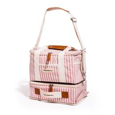 two pink and white striped bags sitting side by side on top of each other in front of a white background