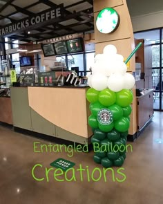 an inflatable starbucks balloon is on display at the starbucks coffee shop's counter