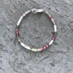 "Tourmaline Bracelet Featuring pink and green tourmaline, along with rainbow moonstone, these are shimmering stones, beautifully faceted for non-stop sparkle. Lovely random pattern, beautiful natural colors. Finished with a sterling silver twisted-rope ring and lobster clasp. Bracelet pictured measures 7 inches at the clasp. This is a regular women's size bracelet and will fit a wrist circumference of up to 6.5 inches. Please make your bracelet length selection from drop down menu. I recommend o Rope Rings, Tourmaline Bracelet, Moonstone Bracelet, Watermelon Tourmaline, Green Tourmaline, Polish Jewelry, Pink Tourmaline, Rainbow Moonstone, Delicate Bracelet