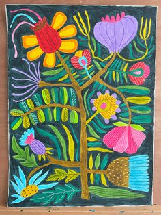 a painting with flowers and leaves painted on it