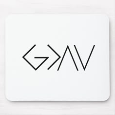 a white mouse pad with the word vak written in black ink on top of it