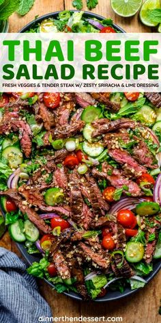 thai beef salad with fresh vegetables and sliced cucumbers in the middle on a plate