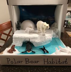 a polar bear habitat is displayed on a table