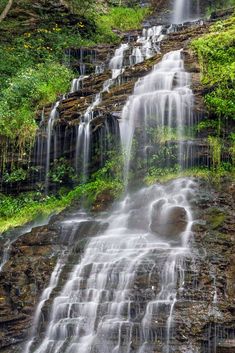 a large waterfall with lots of water cascading down it