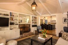 a living room filled with furniture and a fire place