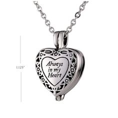 "The heart cremation jewellery pendant is a detailed design with a floral pattern embossed against a darker background. The front is carefully engraved with \"Always in my heart\". This cremation jewelry pendant appeals to many families as a way to memorialize a loved one. The pendant may be worn or displayed in a glass dome. Made of stainless steel, the Heart Cremation Jewelry Pendant holds a small amount of ashes and is suspended on a 20 inch chain. Keep your loved one in your heart always wit Locket Necklace Heart, Always In My Heart, Jewellery Pendant, Cremation Necklaces, Urn Jewelry, Urn Necklace, Heart Locket Necklace, Urn Necklaces, Human Ashes