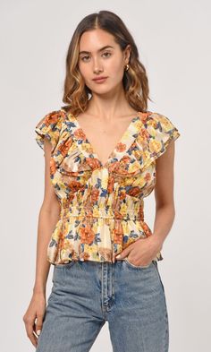 Add a hint of classic romance to your wardrobe with the Cladela Ruffled Peplum Top. Crafted from lightweight fabric with a flattering elastic waist, this peplum top features a deep v-neckline with romantic ruffles and an autumn floral print that's perfect for transitioning from day to night. Ready to make a style statement? Look no further! Classic Romance, Tops And Blouses, Sleeves Blouse, Luxury Women Fashion, Natural Curves, Low Iron, Flutter Sleeves, Small Tops, Formal Occasion