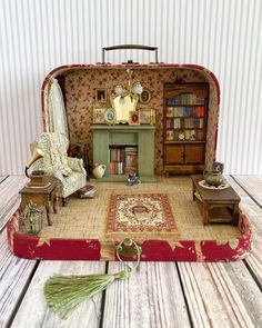 a miniature living room with furniture and bookshelves