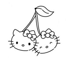 two hello kitty heads hanging from the side of a tree branch with a green leaf on it