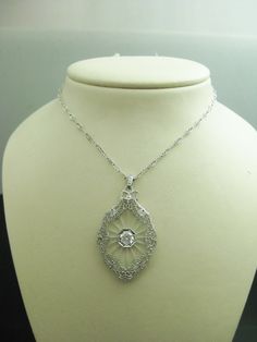 "For Sale: (1) b747 Stunning 14kt White Gold Camphor Glass CZ Pendant and Chain PLEASE READ ENTIRE DESCRIPTION BEFORE PURCHASING This is such a beautiful piece. Made from 14kt white gold and camphor glass with a 1.00ct Cubic Zirconia stone in the center. Stunning filigree work around the edges of the glass. All on a 16\" uniquely designed 14kt white gold chain. Perfect for an Anniversary, birthday, Christmas, or Valentine's Day or whenever gift. Please see pictures for more details! Specifics: 1 Baby Gold Rings, White Gold Chain, White Gold Chains, Cz Pendant, Filigree Ring, Silver Chain Necklace, Vintage Necklace, Fashion Bracelets, Gold Chain