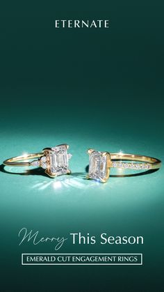 two engagement rings with the words, merry this season emerald cut engagement rings on them