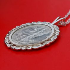 "You are looking at a gorgeous solid 925 sterling silver necklace with an authentic US Walking Liberty half dollar 90% silver AU coin. You have a choice to pick a year date between 1940 and 1947, and let me know if you want earlier year coin BUT no key dates and may not get AU coin before 1940. The coin is set with backside 4-prong, and you can see both sides of the coin. The pendant is made of solid 925 sterling silver, sized about 1.95\"(50mm) x 1.60\"(40mm), and heavy. It comes with a 20\" so Heirloom Silver Necklace With Coin Pendant, Heirloom Silver Coin Jewelry, Classic White Gold Coin Necklaces, Classic Silver Jewelry With Hallmark, Sterling Silver Necklace With Coin Pendant For Anniversary, Anniversary Sterling Silver Necklace With Coin Pendant, Classic Hallmark Jewelry For Memorials, Classic Hallmarked Jewelry For Memorial, Classic Silver Necklace With Coin Pendant