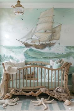 a baby's room with a ship painted on the wall