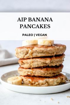 a stack of pancakes with bananas on top