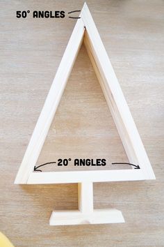 a wooden triangle is shown with measurements for the top and bottom pieces to make it look like