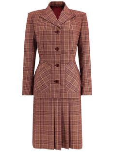 The design of our Socialite label Homefront suit is taken from an original CC41 ladies' suit in our collection, lending this piece incredible accuracy to the styles of the 40s decade. Made of a soft wool-feel check fabric, the warm claret red tones make it ideal for wear during autumn and winter. The Homefront suit has a wealth of gorgeous original details, including the two deep, shaped pockets on the jacket, shoulder padding, and the striking peak lapels. Darts on the jacket create the unmista Vintage Red Skirt Suit For Formal Occasions, 1940s Winter Fashion, Vintage Capsule Wardrobe, Ladies Suit, 1940s Style, Womens Suits, Claret Red, Vintage Trousers, Red Retro