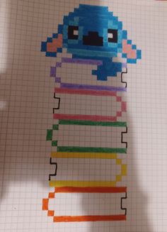 an image of a cartoon character made out of colored crayons on a sheet of paper