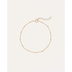 Designed to catch light at all angles, this delicate 14k gold bracelet adds low-key shimmer to any look. Style solo for a minimalist aesthetic or layer them up for the perfect stack. Minimalist 14k Gold Filled Beaded Bracelets For Everyday, Minimalist Chain Bracelet With Tiny Beads, Minimalist Beaded Bracelets With Satellite Chain, Minimalist Beaded Bracelets With Adjustable Chain For Everyday, Minimalist Tarnish-resistant Beaded Bracelets, Delicate Rose Gold Satellite Chain Bracelet, Everyday 14k Gold-filled Satellite Chain Bracelet, Minimalist Beaded Bracelets With Satellite Chain For Everyday, Delicate Yellow Gold Beaded Bracelets For Everyday