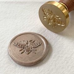 a wax stamp with a bee on it