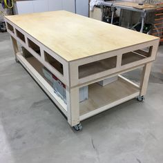 a workbench is being constructed with plywood