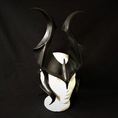 DESCRIPTIONHide in the shadows, dark fantasy beings, as you wear this glossy black leather horned headpiece for fantasy Cosplay or Halloween! Great for evil fairy or black satyr costume. Headdress style avoids claustrophobia while wearing all day at convention or LARP event! Great for Halloween, Cosplay conventions, Renaissance Faire, SCA, dark fantasy costume, Disney villians Cosplay, or Maleficient fandom. Any color. Waterproofed leather, glossy or matte finish, & several choices to affix Fantasy Battlefield, Horned Headpiece, Fantasy Horns, Satyr Costume, Halloween Headpiece, Fantasy Festival, Maleficent Cosplay, Horns Costume, Cosplay Horns