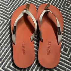 Hermes Beige Textile Thong/ Orange And Brown Foam Sole. In Good Condition With Normal Wear. - Rubber Trim - 0.25” Heel - Size: 7 - Made In Italy Hermes Orange, Hermes Shoes, Thong Sandals, In Italy, Slippers, Size 7, Trim, Italy, Women Shoes