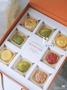 an open box with nine different types of cookies in it